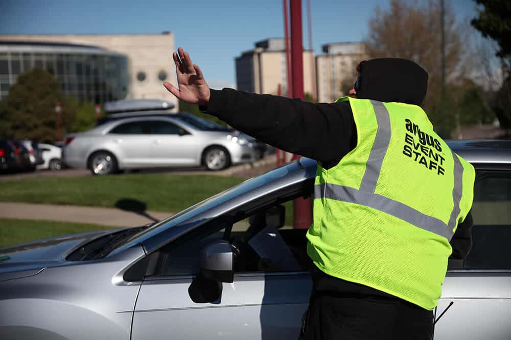 Photo of security guiding event parking for event plannng and event organizers
