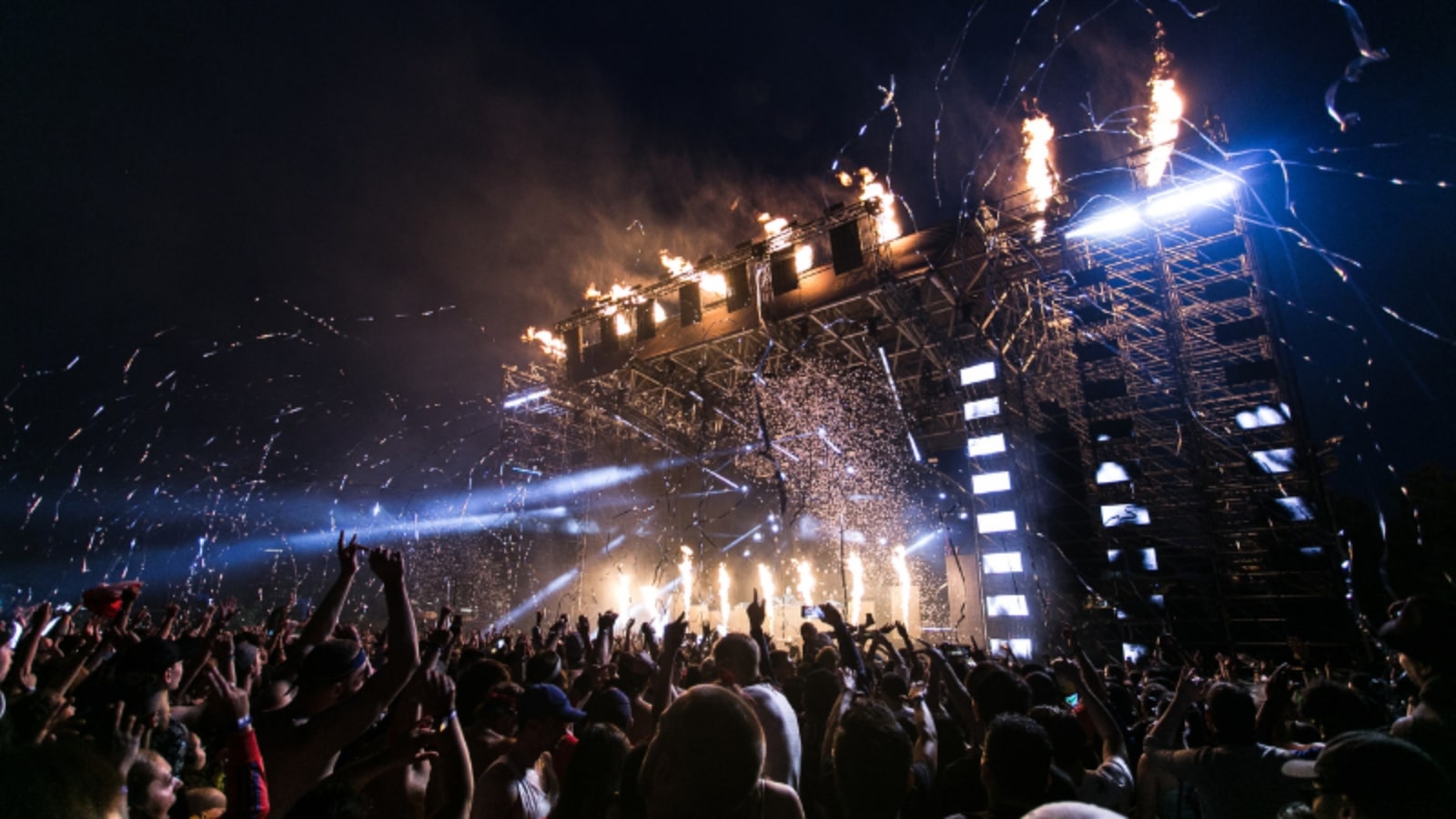 Photo-of-music-event-stage-with-dancing-crowd