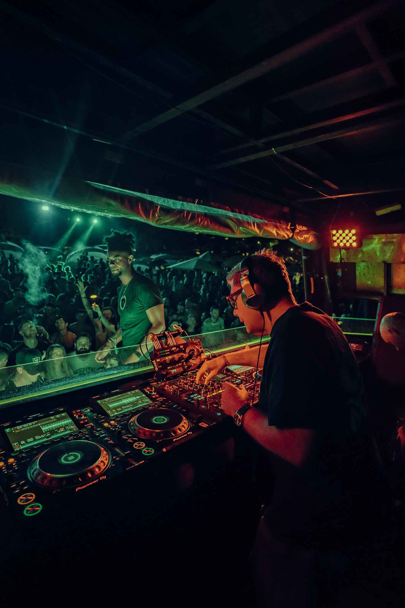 DJ at the booth working the mixer at LOCUS Bali 2025