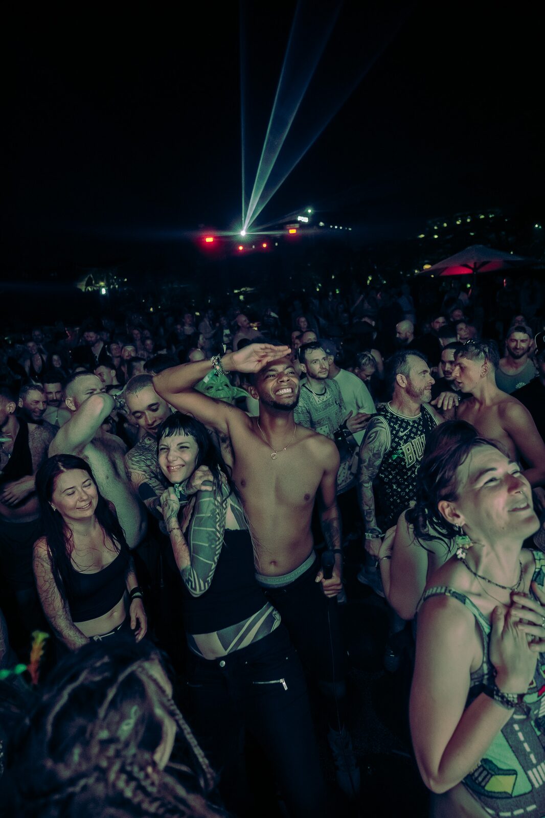 Crowd in a laser-lit dance floor at LOCUS Bali 2025