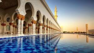 From Dubai: Abu Dhabi Grand Mosque & Louvre Museum with Lunch - Shared Audio Guided Tour & Transfers flyer