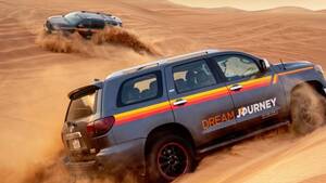 Classic Desert Discovery: Red Dunes Safari, Sandboard & Camel Ride (Afternoon) - Shared Tour flyer